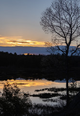 Tranquil Spring sunset at a pond in Muskoka