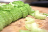 Macro sliced celery, sliced celery on chopping board