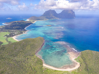 Stunning aerial panorama drone view of Lord Howe Island, an pacific subtropical island in the Tasman Sea between Australia and New Zealand. North beach and Old Settlement Beach in the foreground.