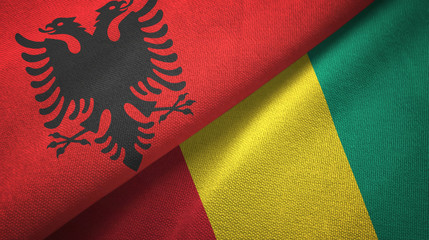Albania and Guinea two flags textile cloth, fabric texture