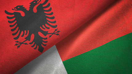 Albania and Madagascar two flags textile cloth, fabric texture