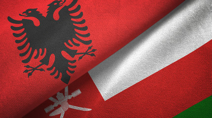 Albania and Oman two flags textile cloth, fabric texture
