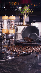 coffee beans and coffee cup on black marble