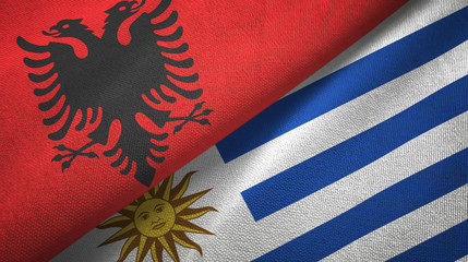Albania and Uruguay two flags textile cloth, fabric texture