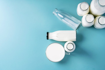 Fresh milk in different glass bottles