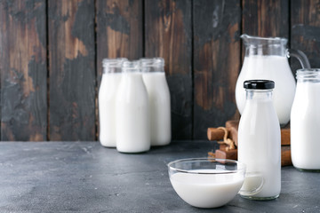 Fresh milk in different glass bottles