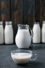 Fresh milk in different glass bottles