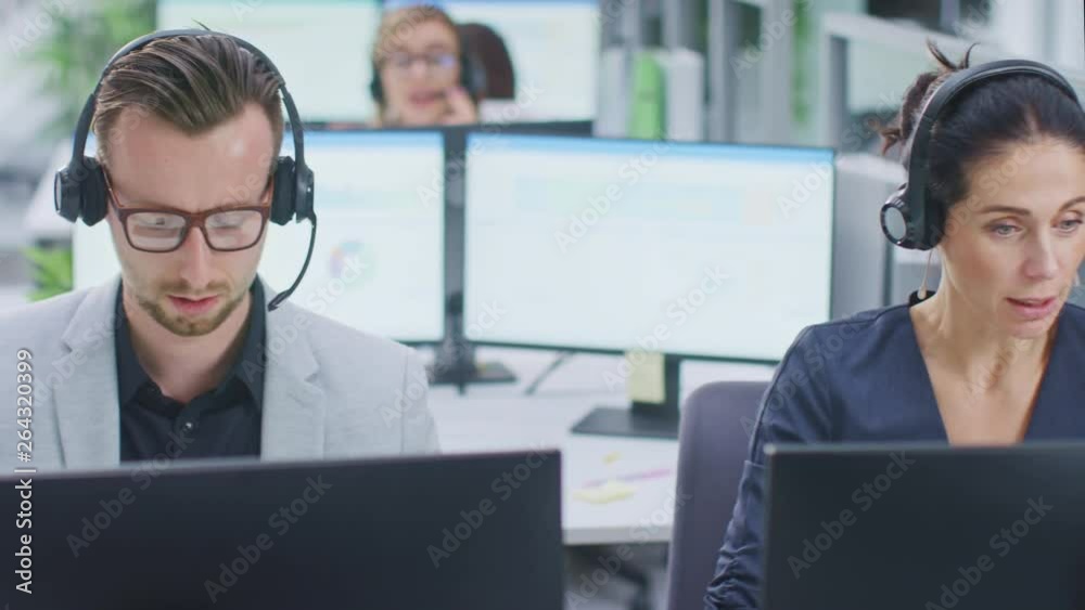 Poster in modern open space office: team of customer support people and salesmen working at their desktop c