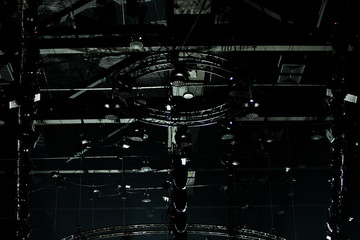 Performance moving LED Par lighting on construction light beam ray downward in yellow blue color with smoke, on Concert and Fashion Show stage ramp, low light exposure with grain and noise