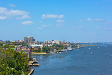 A panoramic view on Old Town Alexandria waterfront in Virginia, USA. Potomac River panorama with a view on Washington DC.