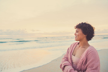 Happy Young Woman on Beach During Sunrise