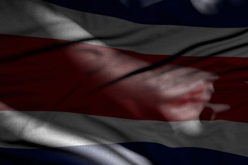 beautiful independence day flag 3d illustration. - image of dark Costa Rica flag with folds lay in shadows with light spots on it