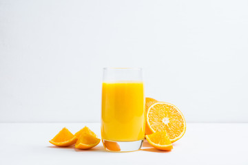 Fresh squeezed orange juice on the rustic background. Selective focus. Shallow depth of field. 