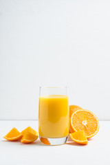 Fresh squeezed orange juice on the rustic background. Selective focus. Shallow depth of field. 