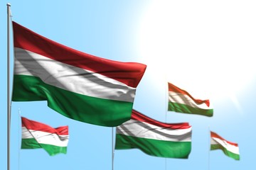 pretty 5 flags of Hungary are waving against blue sky photo with bokeh - any holiday flag 3d illustration..