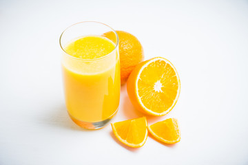 Fresh squeezed orange juice on the rustic background. Selective focus. Shallow depth of field. 