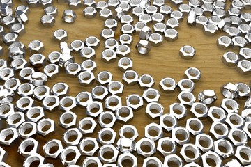 female screws on wooden table - beautiful industrial 3D illustration, picture for designer using