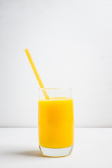 Fresh squeezed orange juice on the rustic background. Selective focus. Shallow depth of field. 