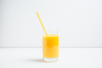 Fresh squeezed orange juice on the rustic background. Selective focus. Shallow depth of field. 