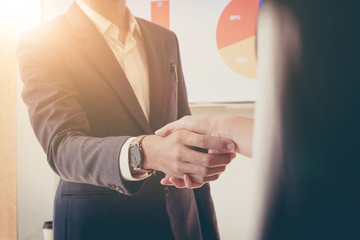 Close up of Business people shaking hands, finishing up meeting, business etiquette,...