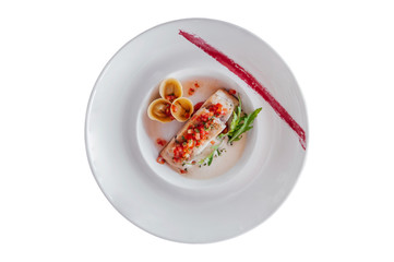 Grilled sea bass fillet with tortellini pasta isolated on white background