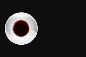 Coffee cup on black background. Black coffee top view. Espresso on table. copy space