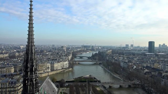 4K, Elevated view of Paris and Seine river from Notre Dame Cathedral on winter day, observing the city from the top of the church. Famous touristic places and popular travel destinations in Europe-Dan