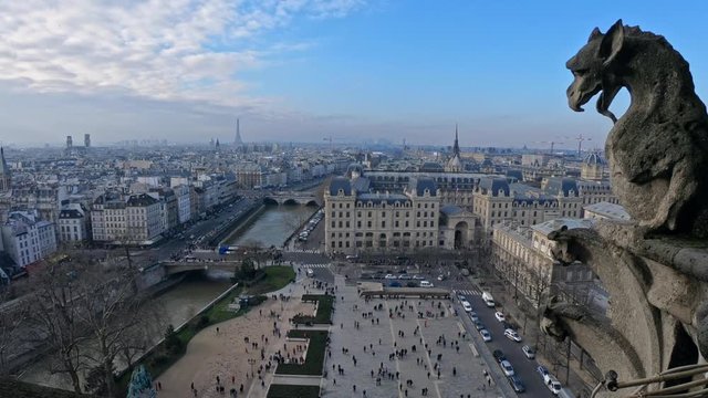 4K, Famous gargoyle statue in Notre Dame Cathedral with city of Paris background. Stone chimera watch over Paris, France. Famous touristic places and popular travel destinations of Europe-Dan