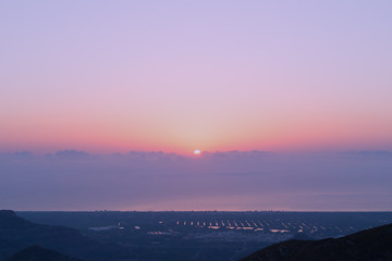 Panorama during sunrise. Cloudy sunrise over Mediterranean Sea in Valencia region, Spain.