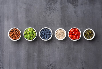 Healthy eating ingredients: fresh vegetables, fruits and superfood. Nutrition, diet, vegan food concept