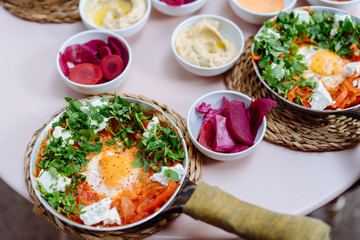 Shakshuka, Fried Eggs in Tomato Sauce on the Table