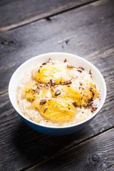 Oatmeal with roasted bananas and chocolate. Selective focus. Shallow depth of field.