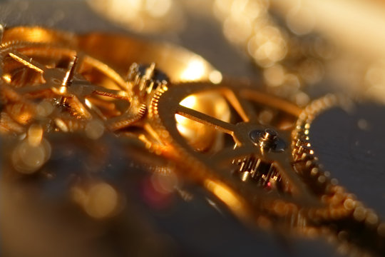 Abstract blurred background. gold watch mechanism.