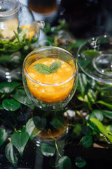 Fresh passion fruit and a glass of passion fruit drink