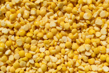 texture of crushed yellow peas close-up, food background