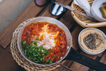 Shakshuka, Fried Eggs in Tomato Sauce on the Table