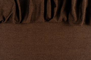 Texture of dark brown fabric close up. 