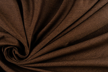 Texture of dark brown fabric close up.  
