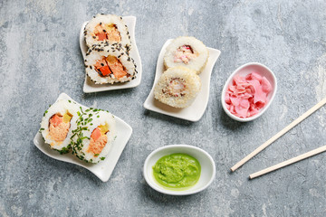 Sushi set on grey stone background.