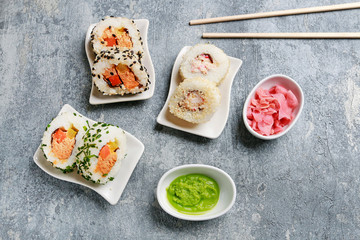 Sushi set on grey stone background.