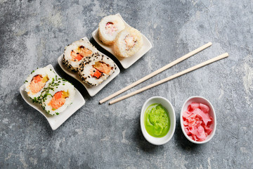 Sushi set on grey stone background.