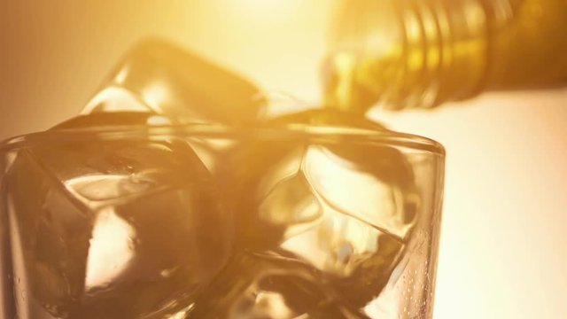 Cinemagraph loop - pouring scotch whiskey over ice
