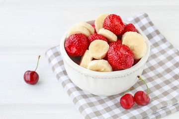 Fruit salad with bananas and strawberries.