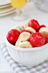 Fruit salad with bananas and strawberries.
