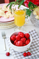 Glass of banana juice and fruit salad on the table.