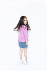 Rear view smiling little child girl flicking hair over white background. Freedom kid movement concept.
