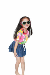 Happy little Asian kid girl wearing a flowers summer dress and sunglasses isolated on white background. Summer fashion kid concept.