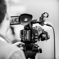 Camera at media conference