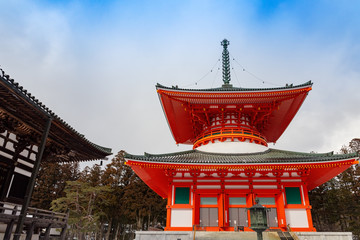 Konpon Daitô red pagoda in Danjo Garan, Koyasan, covered with snow on a clear winter day, UNESCO World Heritage area, Wakayama Prefecture,  Japan.