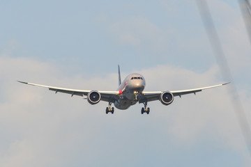 Passenger airplane landing at the airport